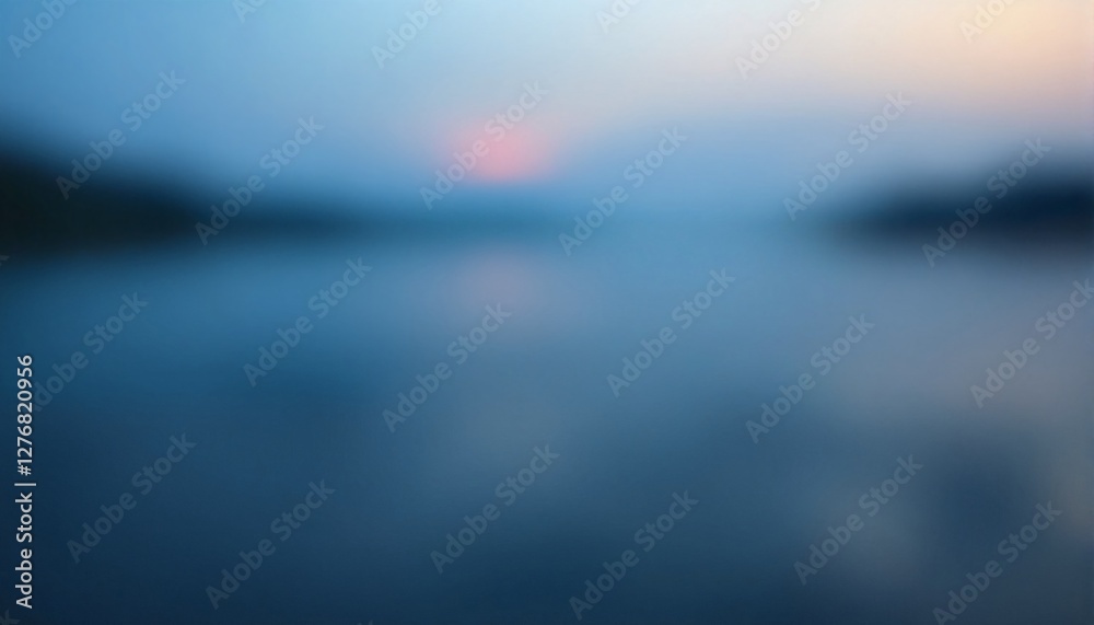Fototapeta premium The image appears to be an out of focus sunset over water.