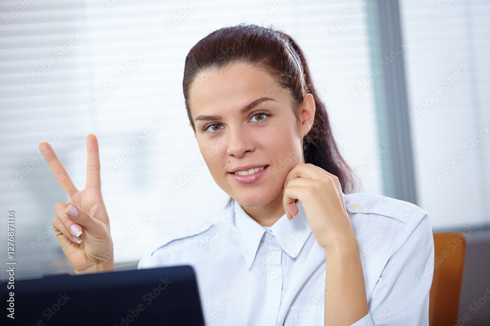 Young businesswoman sitting at workplace