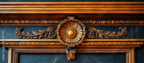Ornate wooden frame with intricate carvings and a central medallion detail