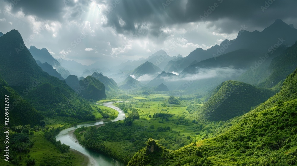 Fototapeta premium A vast verdant valley framed by towering misty mountains, where nature thrives under a dramatic sky.