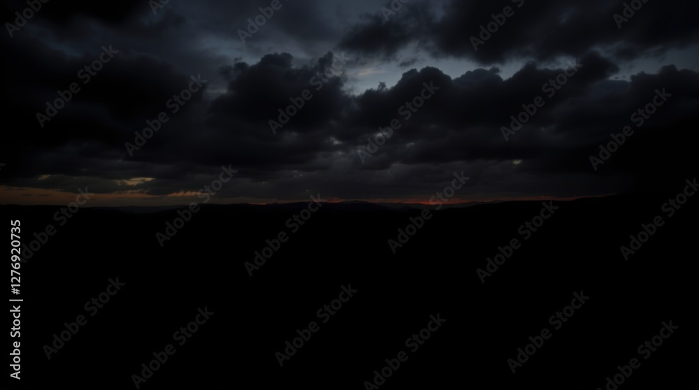Dramatic Dark Cloudscape at Dusk with Mountain Silhouette Landscape Dramatic Dark Cloudscape at Dusk with Mountain Silhouette Landscape