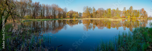 Wallpaper Mural A panorama of a spring lake with flowering trees, a cloudless sky and a surface of clean water Torontodigital.ca