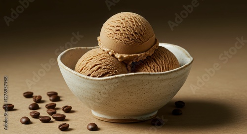 Bowl of coffee ice cream scoops with coffee beans on brown background