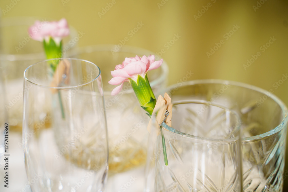 Elegant floral arrangements in glasses create a charming atmosphere at a celebration Elegant floral arrangements in glasses create a charming atmosphere at a celebration