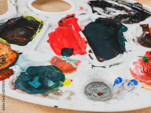 Fototapeta Naklejka Na Ścianę i Meble -  An artist's palette with bright colors, ready to create new masterpieces.
