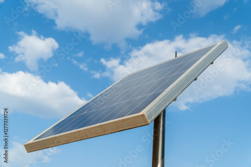 Photovoltaic plant infrastructure against blue sky with clouds photo