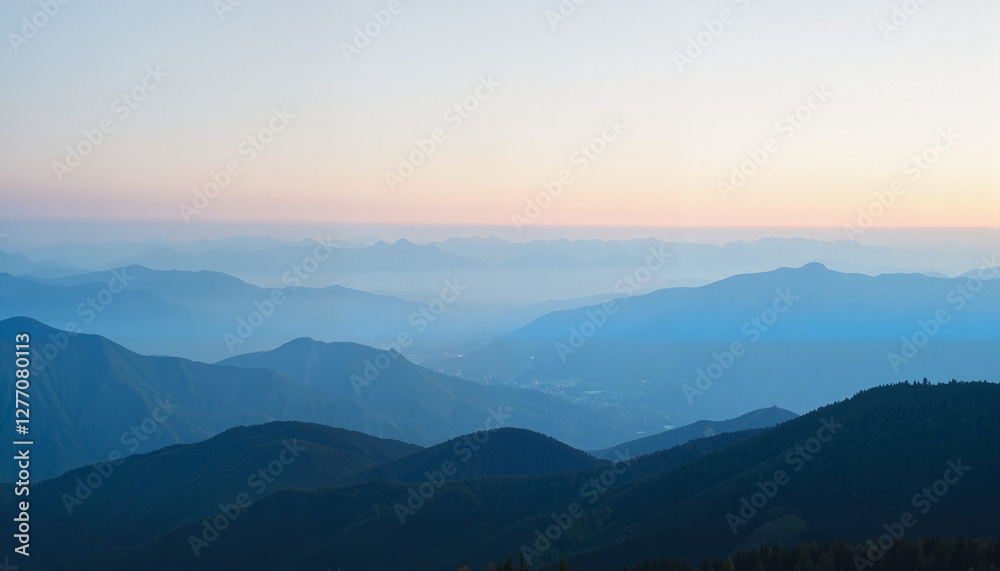 A scenic view of mountains at dusk. A scenic view of mountains at dusk.