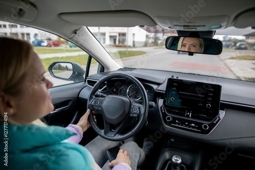 A Modern Driver Skillfully Navigating an Electric Vehicle Along an Urban Road Environment