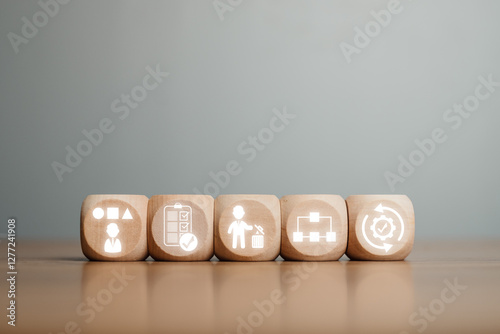 Wooden blocks depicting the 5S methodology icons for improving workplace organization and efficiency. photo