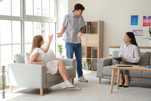Young couple quarreling at ...