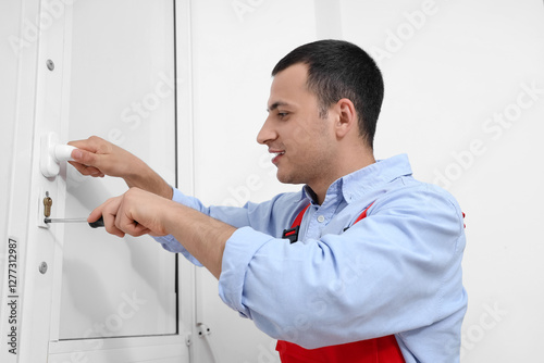 Male worker with screwdrive...