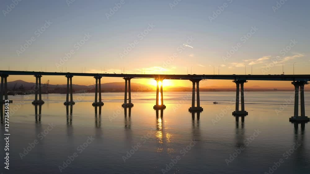Coronado Bridge in San Diego, California at sunrise. Sunbeam shining through poles of bridge. Coronado Bridge in San Diego, California at sunrise. Sunbeam shining through poles of bridge.