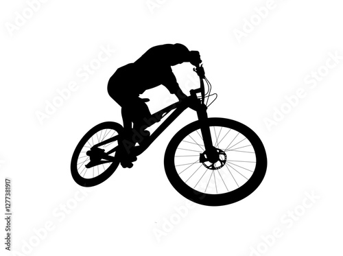 silhouette of a man riding a bicycle