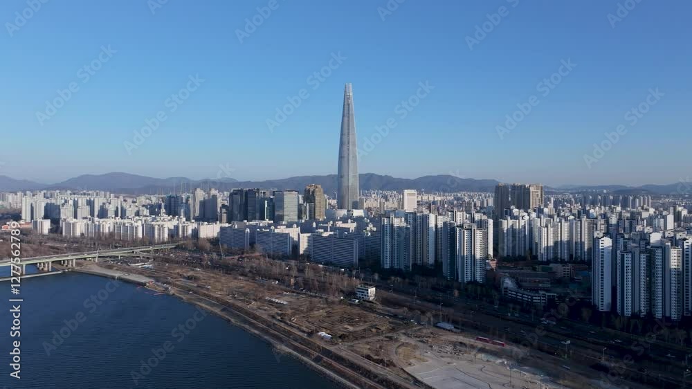 Aerial view of Seoul, South Korea, with the Hangang River winding through the city, video by towering skyscrapers and historical landmarks Aerial view of Seoul, South Korea, with the Hangang River winding through the city, video by towering skyscrapers and historical landmarks