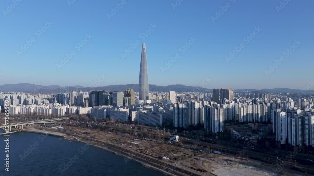 Aerial view of Seoul, South Korea, with the Hangang River winding through the city, video by towering skyscrapers and historical landmarks Aerial view of Seoul, South Korea, with the Hangang River winding through the city, video by towering skyscrapers and historical landmarks