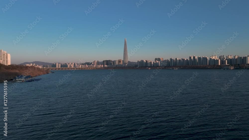 Aerial view of Seoul, South Korea, with the Hangang River winding through the city, video by towering skyscrapers and historical landmarks Aerial view of Seoul, South Korea, with the Hangang River winding through the city, video by towering skyscrapers and historical landmarks