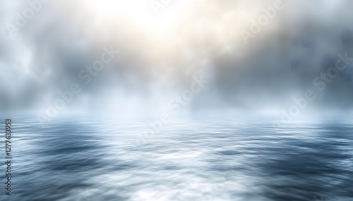 Misty seascape with light breaking through cloud cover above