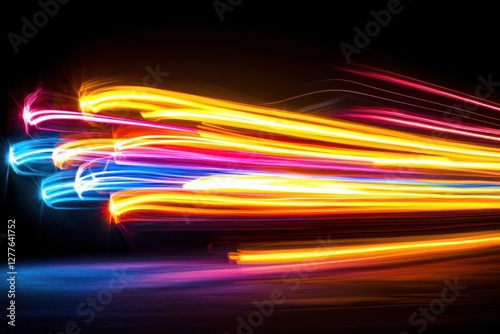 Vibrant light streaks illuminate dark space creating dynamic abstract design with colorful glow and movement