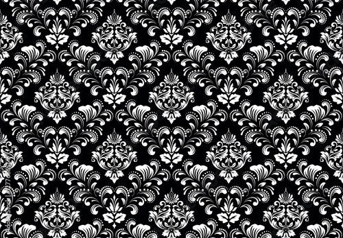 Wallpaper in the style of Baroque. White and black floral ornament. Seamless vector background. Graphic pattern for fabric, wallpaper, packaging. Ornate Damask flower illustration.