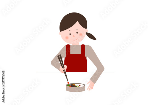 お弁当を詰める女性