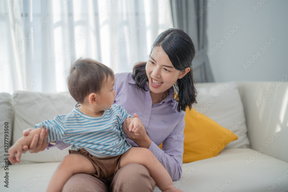 Happy interaction between mother and child in a bright living room during the afternoon Happy interaction between mother and child in a bright living room during the afternoon