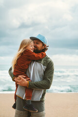 Father and daughter hugging family lifestyle outdoor child girl with daddy together walking on the beach summer vacations parent love happy moments candid emotions Fathers day holiday
