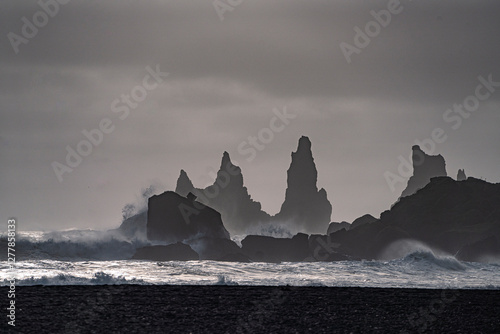 Reynisfjara is a world-famous black-sand beach found on the South Coast of Iceland, which features basalt columns and the dramatic Reynisdrangar sea stacks