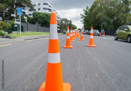 Obraz na płótnie Orange traffic cones lining up the street. Roadworks in Auckland. w salonie