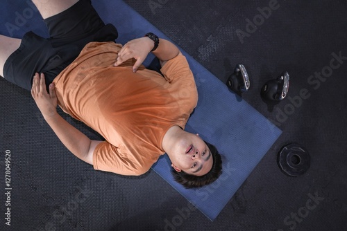 Overweight man's grueling indoor gym challenge exhaustion meets determination