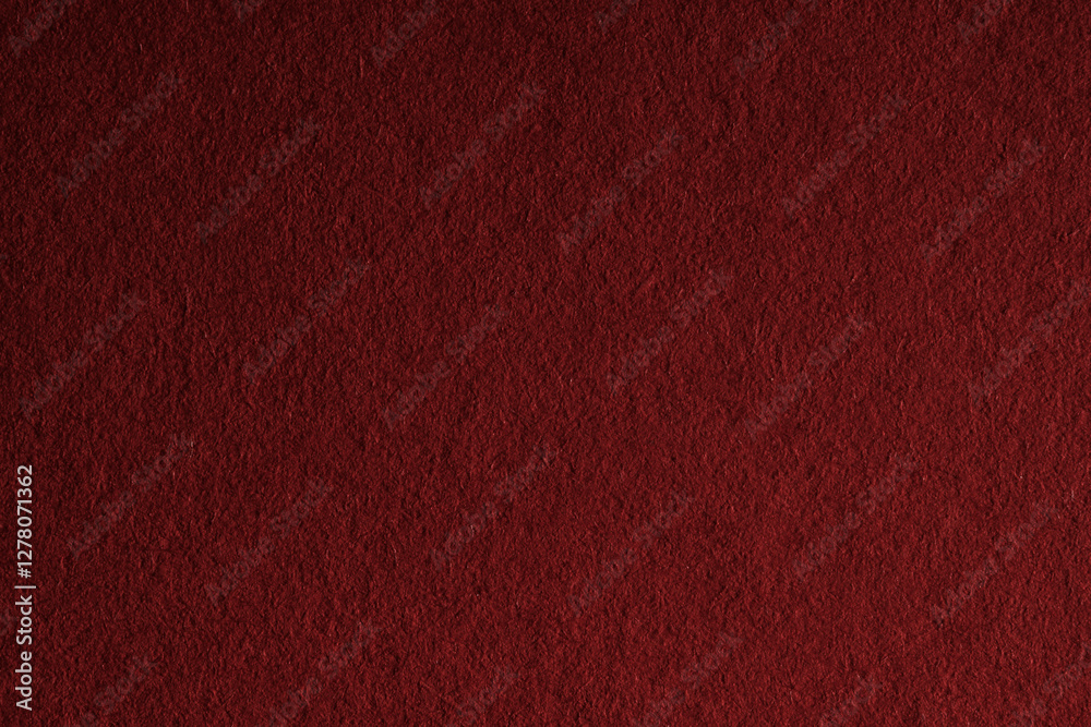 Fototapeta premium Macro close-up of dark red felt material filling the frame