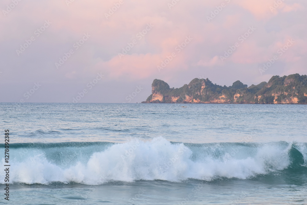Fototapeta premium beach waves with the beauty of the sunset