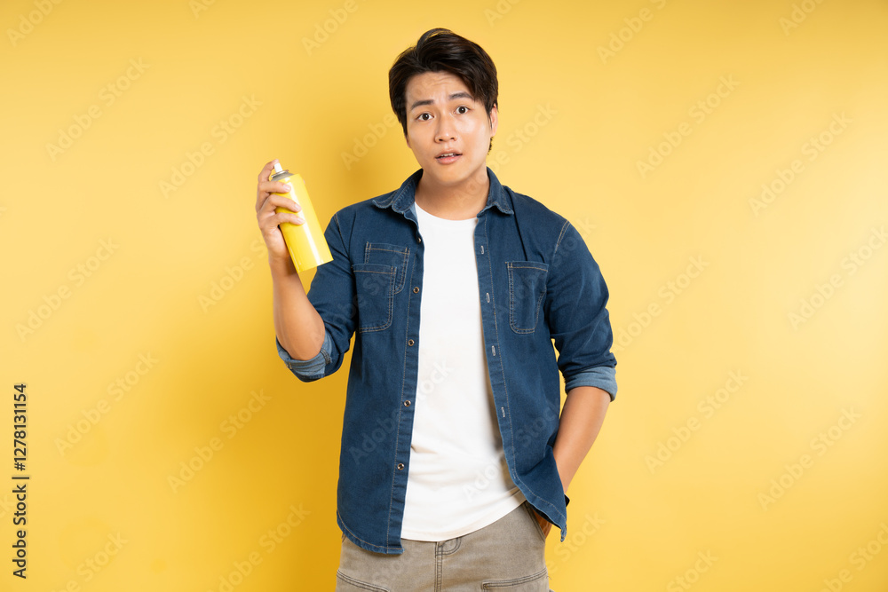 portrait of a man holding a paint vase posing on a yellow background, portrait of a man holding a paint vase posing on a yellow background,