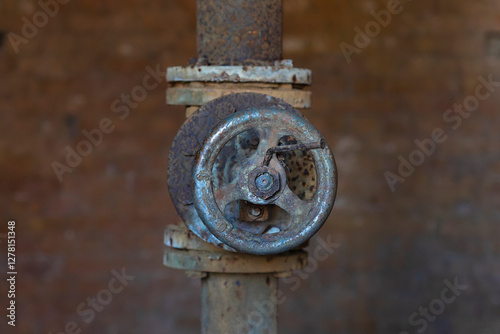 Old metal tap for water supply.