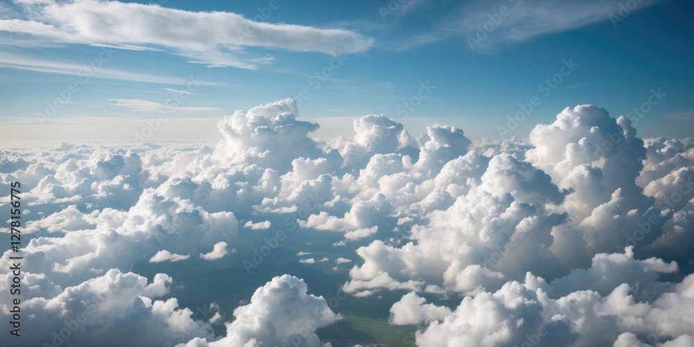 Fototapeta premium Aerial view of fluffy white cumulus clouds against a clear blue sky during daytime with soft sunlight illuminating the scene