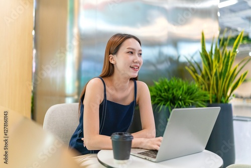 Asian Businesswoman Using Laptop In a Modern Office Free Download Asian Businesswoman Using Laptop In a Modern Office - GFXLoad