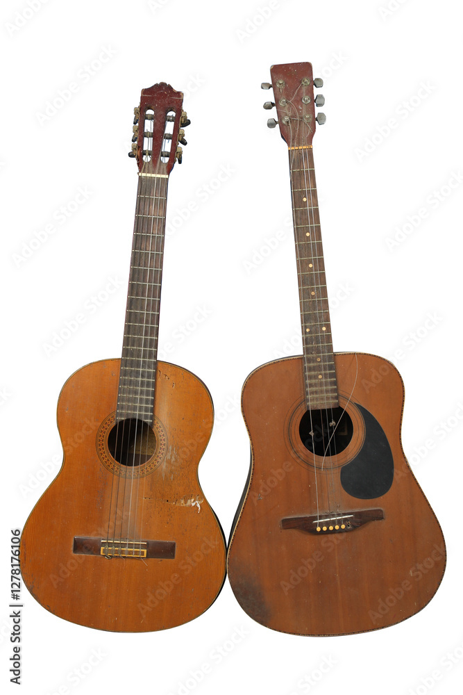 Obraz premium Two old acoustic guitar isolated on white background.
