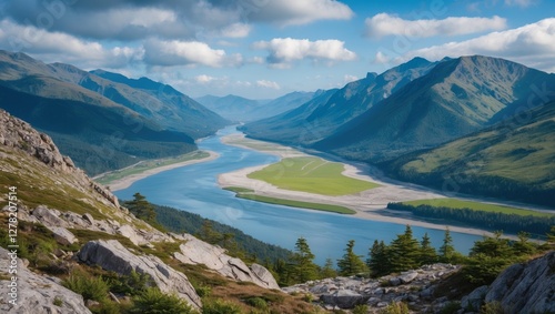 Majestic mountain landscape showcasing a river valley and estuary with lush greenery and scenic hiking trails under a clear blue sky.
