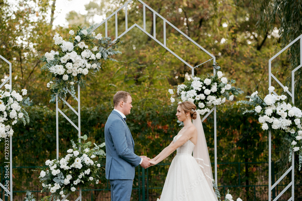 wedding ceremony of the newlyweds on the glade