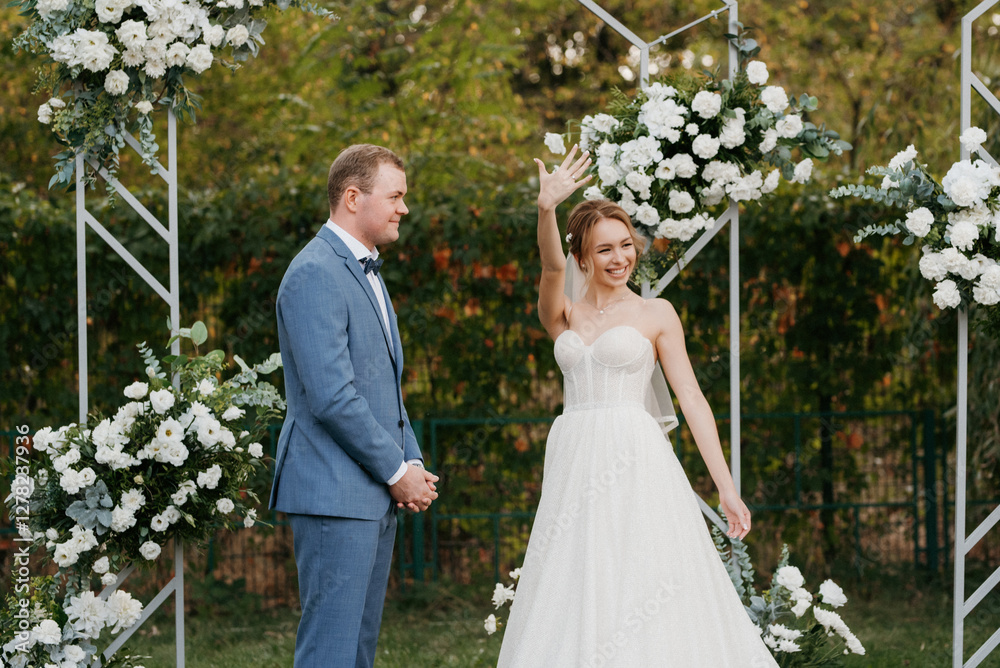 wedding ceremony of the newlyweds on the glade