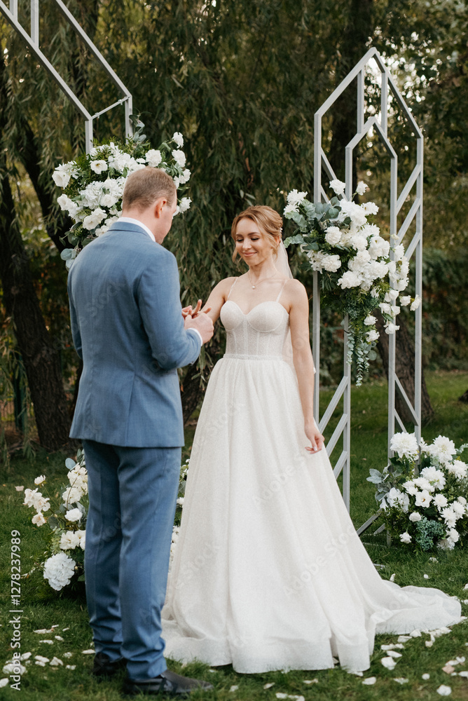 wedding ceremony of the newlyweds on the glade