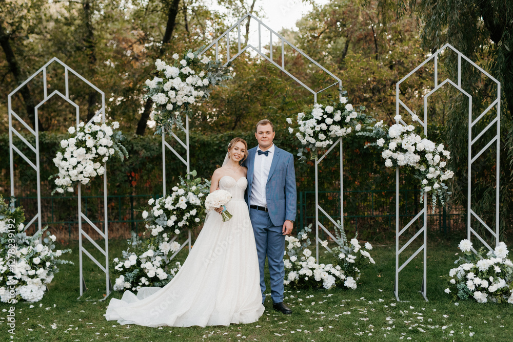wedding ceremony of the newlyweds on the glade