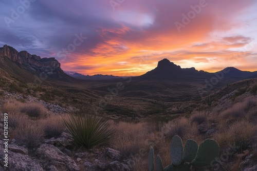 majestic texas desert panorama with rugged mountains silhouetted against a blazing orange and purple sunset sky featuring iconic saguaro cacti in foreground
