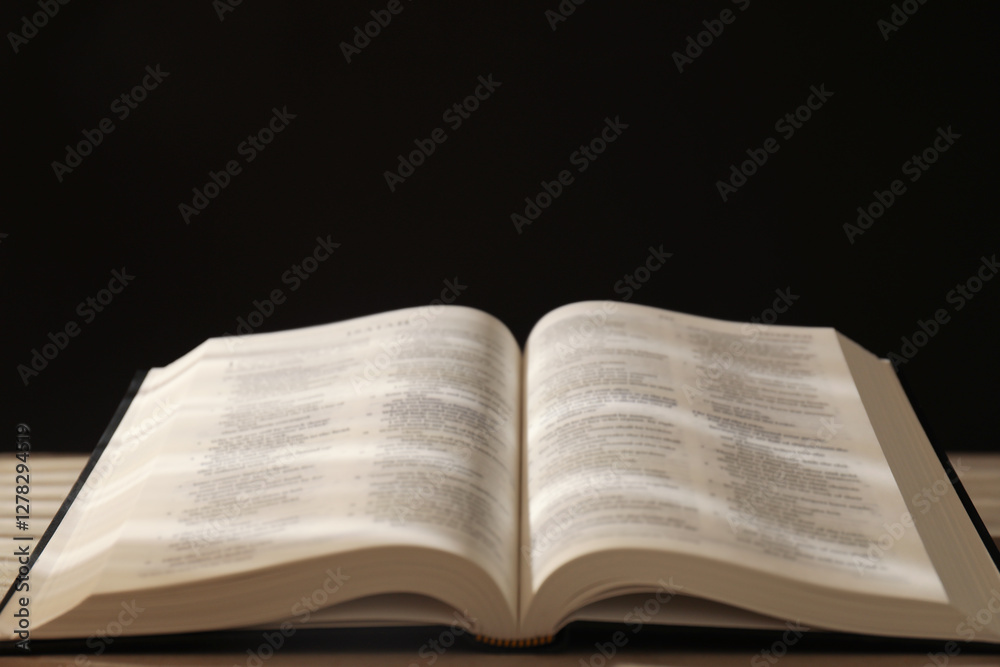 Open Holy Bible in English language on table, closeup Open Holy Bible in English language on table, closeup