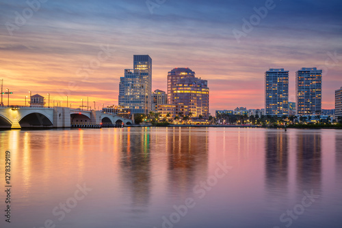 Fototapeta Naklejka Na Ścianę i Meble -  West Palm Beach, Florida, USA. Cityscape image of West Palm Beach, Florida with reflection of the city skyline in the water at beautiful sunset.
