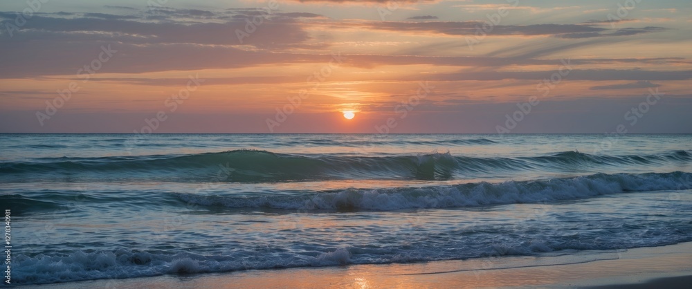 Obraz premium Serene Seascape at Sunset with Gentle Waves and Soft Sky Colors Ideal for Backgrounds and Text Overlay