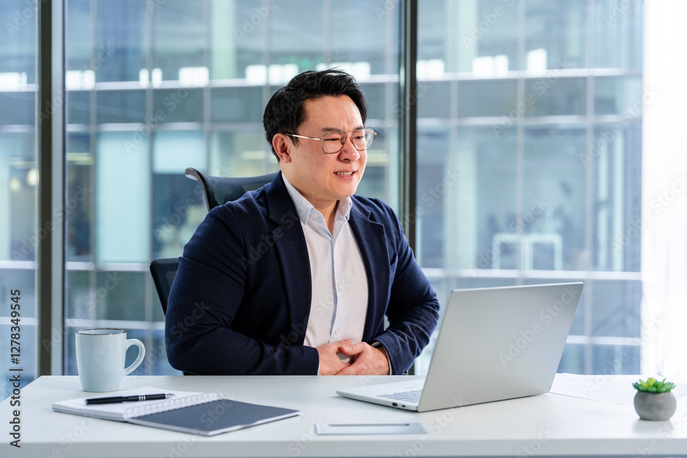 Confident businessman in modern office engaged in virtual meeting, exuding professionalism and positivity, seated at a neat desk. Confident businessman in modern office engaged in virtual meeting, exuding professionalism and positivity, seated at a neat desk.