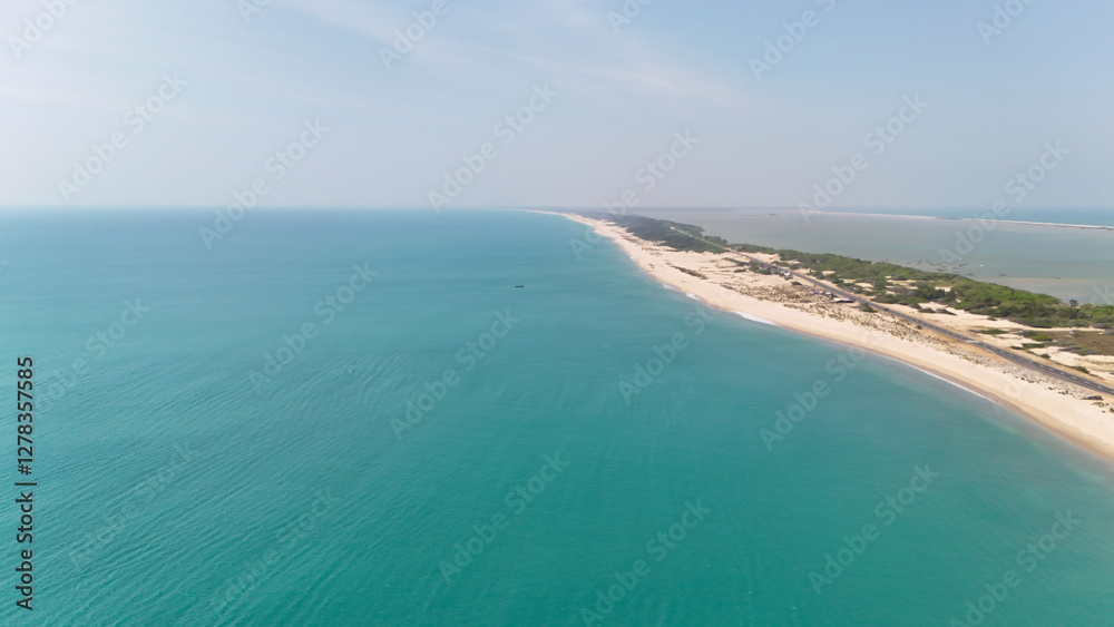 A spectacular drone shot of Dhanushkodi’s endless road leading into the ocean, flanked by the Bay of Bengal and the Indian Ocean. A spectacular drone shot of Dhanushkodi’s endless road leading into the ocean, flanked by the Bay of Bengal and the Indian Ocean.