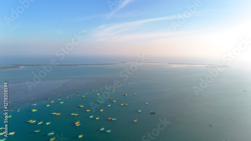 Aerial view of boats and ships scattered across the vast blue waters of the Indian Ocean near Rameswaram, Tamil Nadu. photo