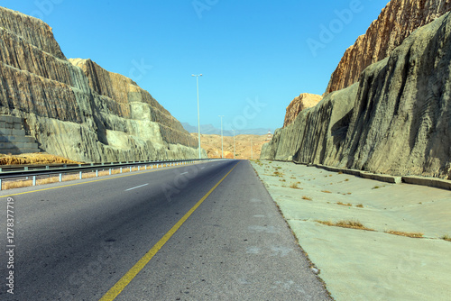 Highway along high lifeless mountains in Oman photo