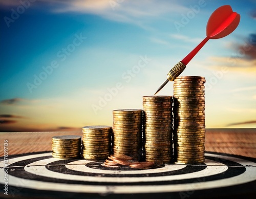 Precision Targeting Dart Arrow on Bullseye with Coins Financial Hiring Fired Business photo